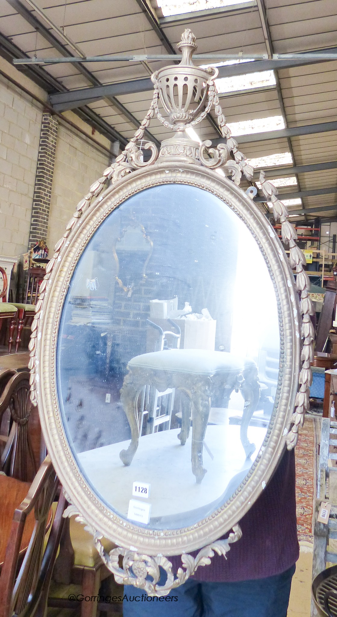 A Victorian oval giltwood and gesso wall mirror, width 56cm, height 104cm